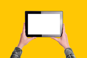 Woman Holding Digital Tablet Computer over Yellow Solid Backgrou