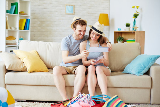 Couple with flight tickets