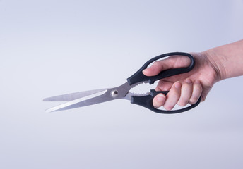 scissors. scissors with hand on background. scissors on a backgr