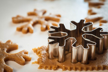 Gingerbread dough and the metallic snowflake form 