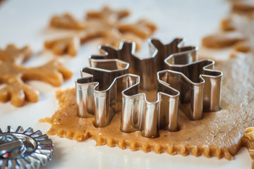Gingerbread dough and the metallic snowflake 