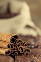 Cinnamon sticks, coffee grains and old grinder