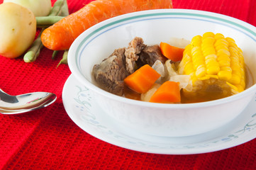beef soup with fresh onion, carrots and corn