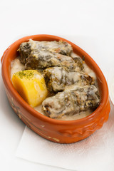 Cabbage rolls in elegant ceramic bowl in restaurant