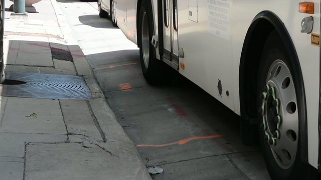 Closeup Of A City Bus Pulling Up To A Stop
