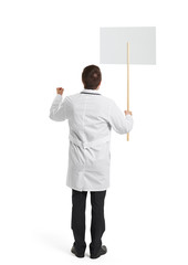 doctor with placard over white