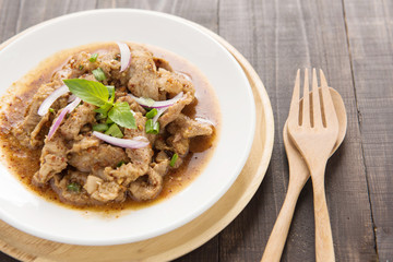 Thai food name is Grilled pork with spicy salad, Thai food.