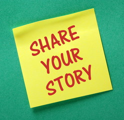 Share Your Story text on a yellow sticky reminder note