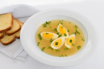 soup with eggs and bread