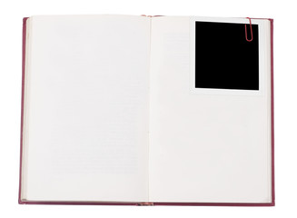 Red hardcover book and photo frame