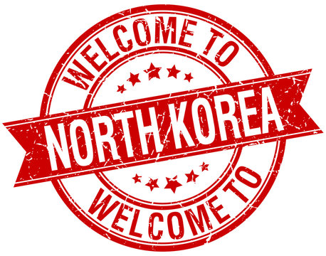 welcome to North Korea red round ribbon stamp