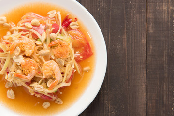 Papaya salad thai food on wooden background