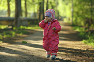 Fototapeta premium cheerful child walks in the park