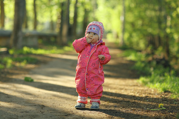 Fototapeta premium cheerful child walks in the park