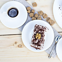 Delicious chocolate cake on plate on table on light background