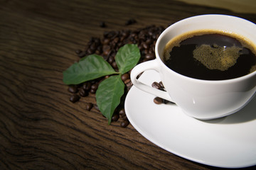 Cup of coffee on old wooden background