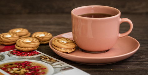 Cup of Tea and Biscuits with Magazine