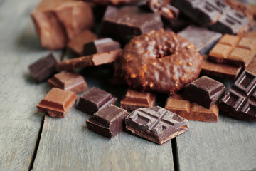 Set of chocolate on wooden table, closeup