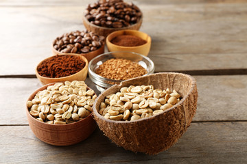 Various of coffee in small dishes on wooden background