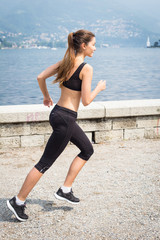 Young attractive woman running outdoors