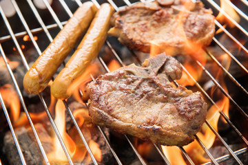 BBQ pork meat and sausages on the grill.