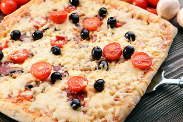 Delicious homemade pizza on table close-up