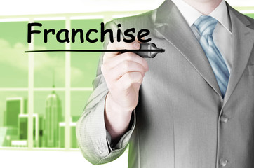 business man writing franchise