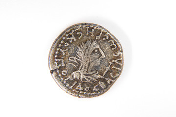 Vintage silver coin with portrait of king on a white background