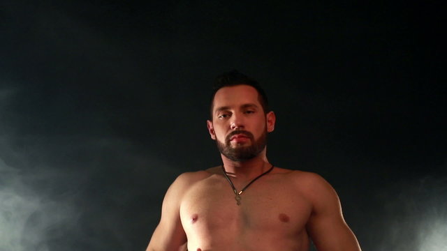 View of bearded macho sexy moves at camera
