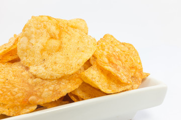 Potato chips barbecue flavour on white background.