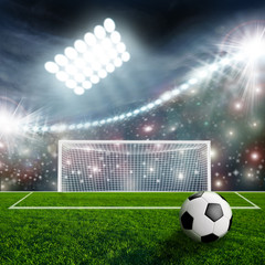 Soccer ball on green stadium arena