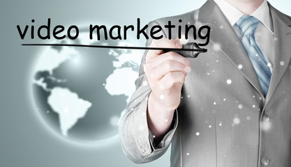 business man writing Video Marketing