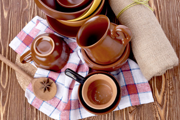 plates and cups on wooden table