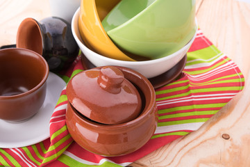 plates and cups on wooden table