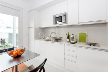 modern kitchen with white furniture