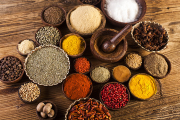 Obraz na płótnie Canvas Wooden table of colorful spices