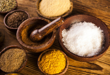 Wooden table of colorful spices