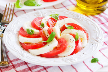 Caprese salad with tomatoes, mozzarella and basil.