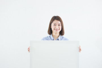 Fototapeta premium ボードを持つ女性
