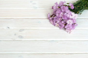 Obraz na płótnie Canvas bouquet of cornflowers on a white wooden background
