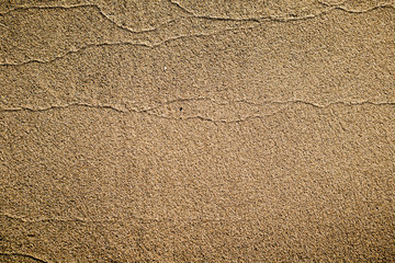 Texture of sea sand on coast