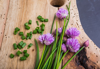 Obraz na płótnie Canvas Bunch of fresh chives on a wooden table