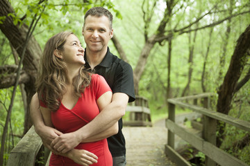 Fototapeta premium A couple standing on forest trail