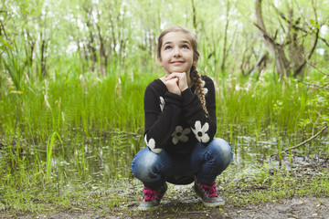 Adorable laughing child in forest