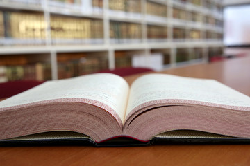 Old open book in library