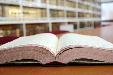 Old open book in library