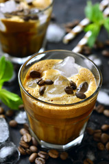 Iced coffee on black background.