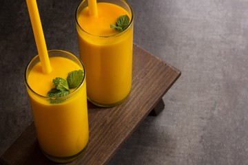 Mango lassi on beautiful grey background with copy space