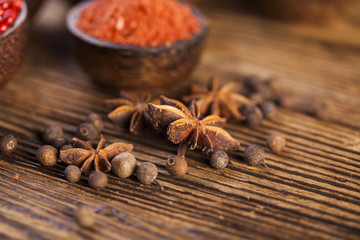 Spices and herbs in wooden bowls
