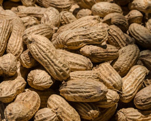 Fototapeta premium Many peanuts in shells, one upon the other